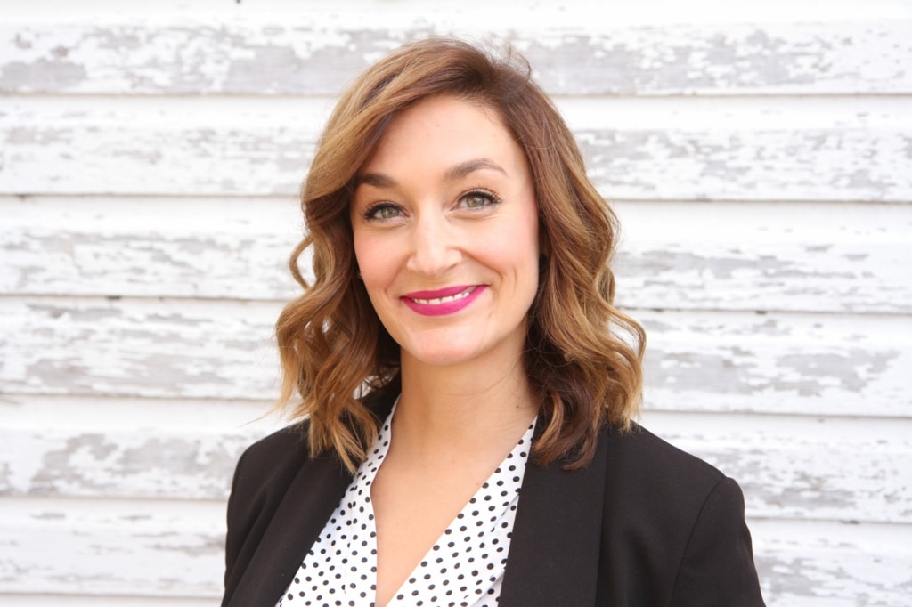 katrina foster headshot with wood background